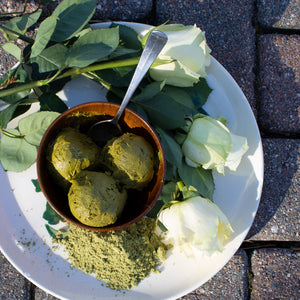 Matcha Green Tea Ice Cream Vegan Sweet Potato Ice Cream on White Plate with Roses and Matcha Powder, long shadows and spoon in bowl